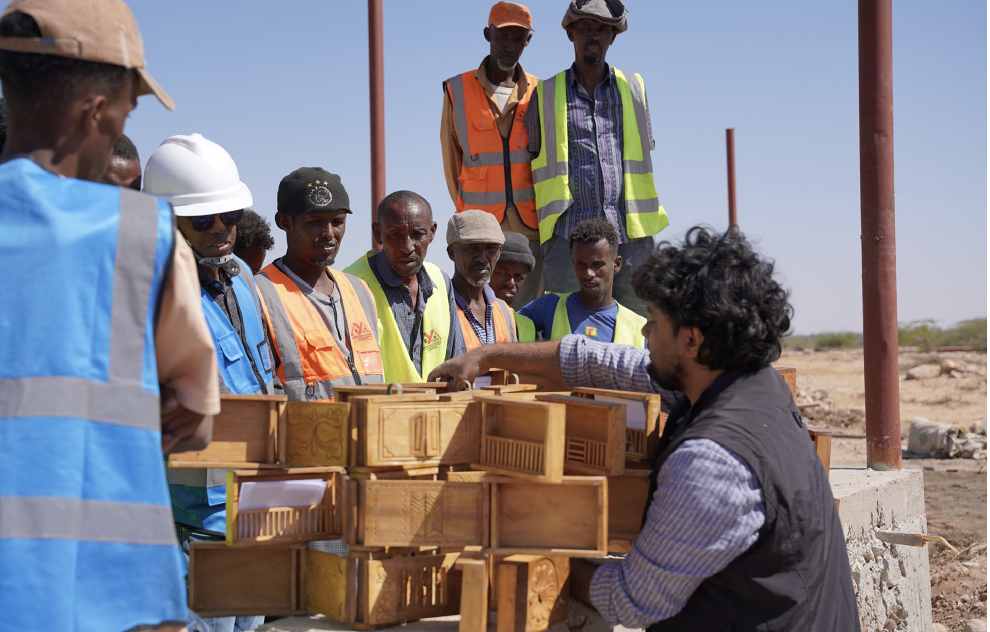 Rizvi assembling the structure in another "nest"