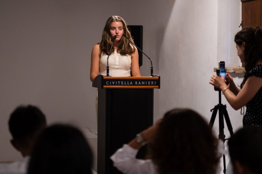 2025 intern introduces Fellows at podium